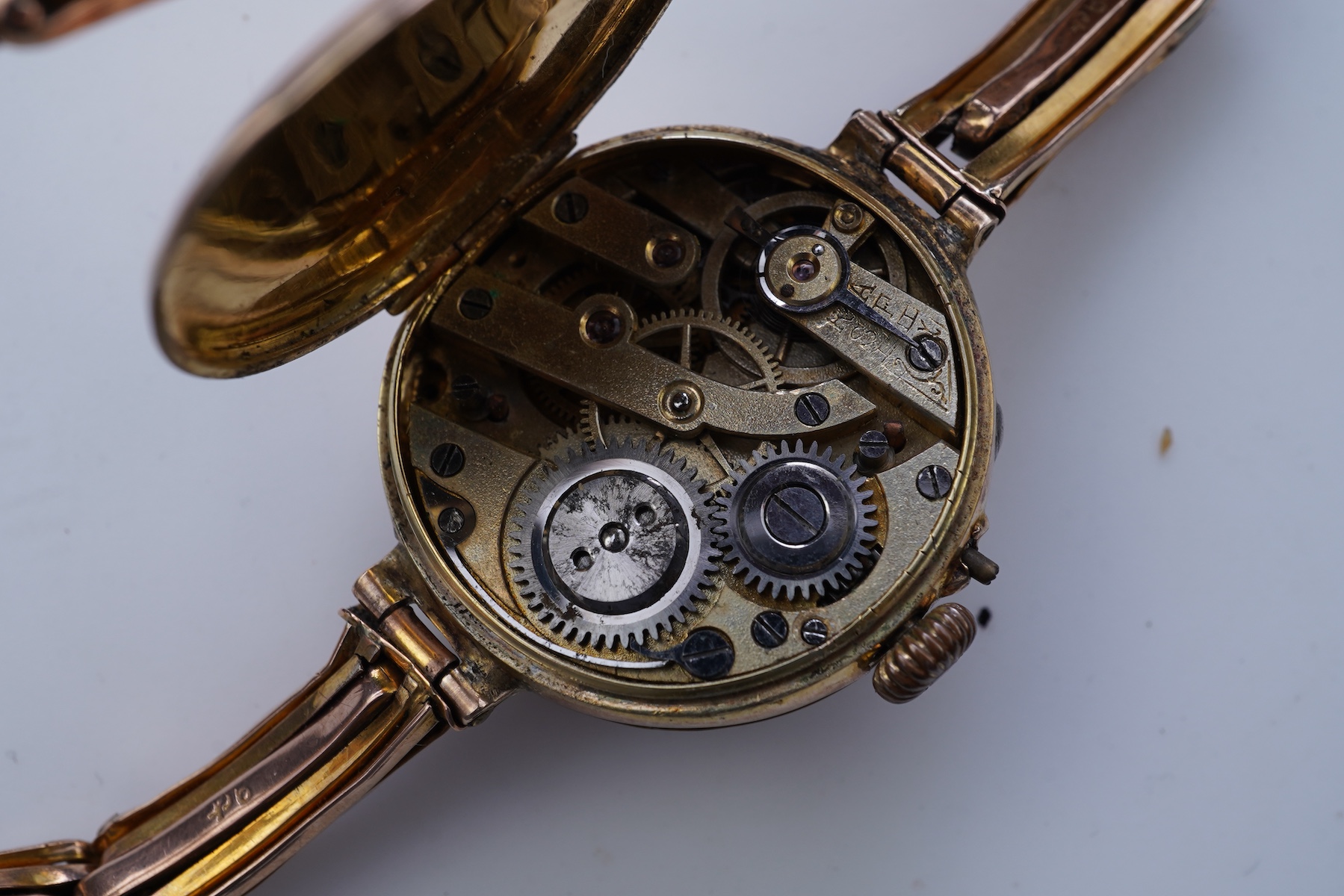Two gold bracelets and a gold watch